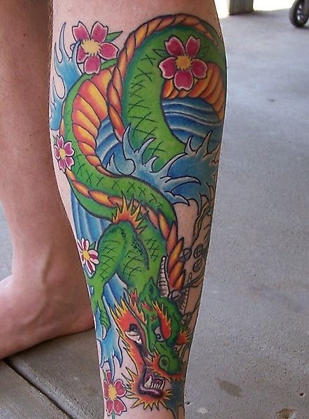 Цветочный дракон - татуировка на голени