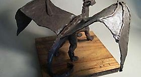 Металическая статуэтка с дракончиком